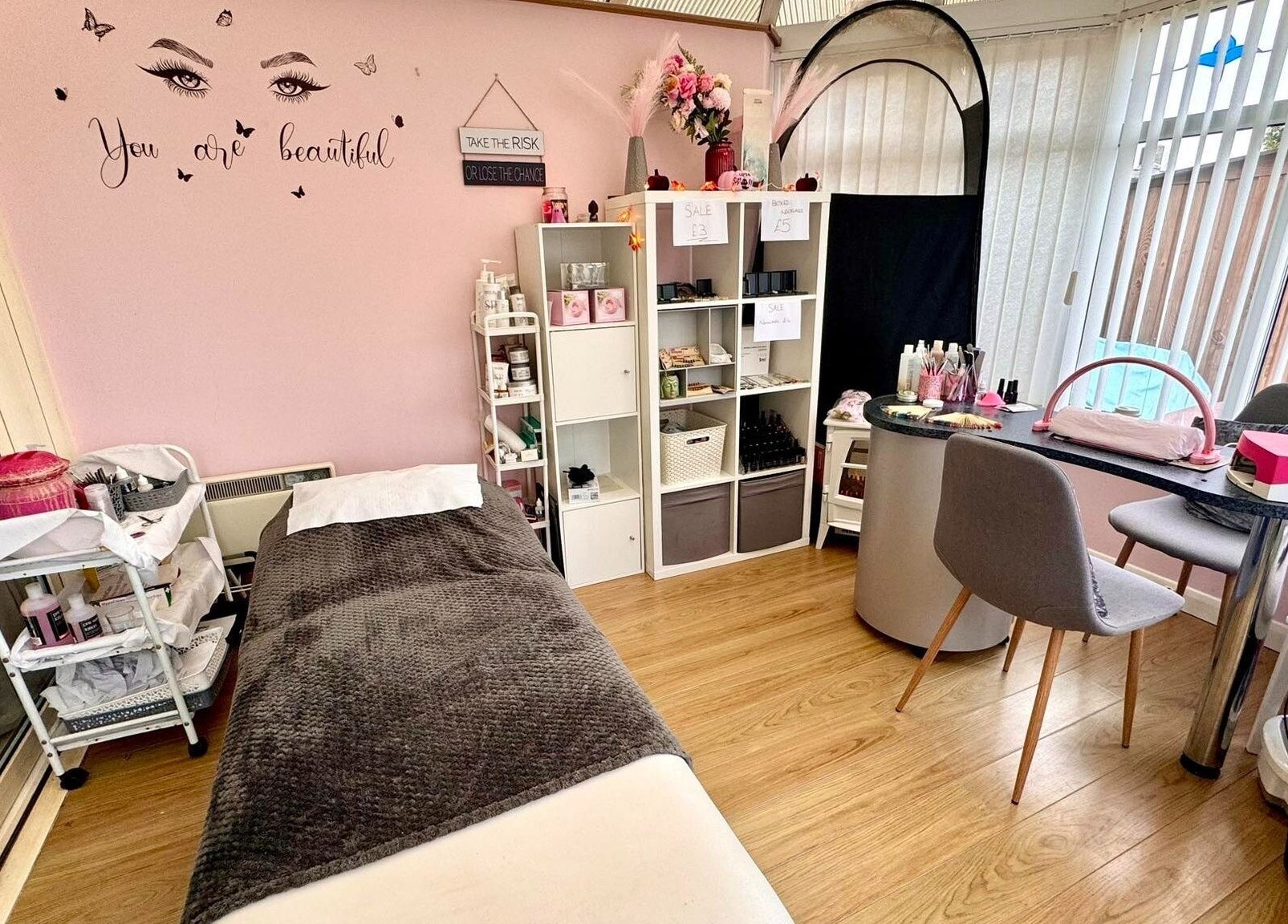 Cozy beauty room at Absolute Beauty & Aesthetics, North Hykeham, England, GB. Modern decor with pink accents.