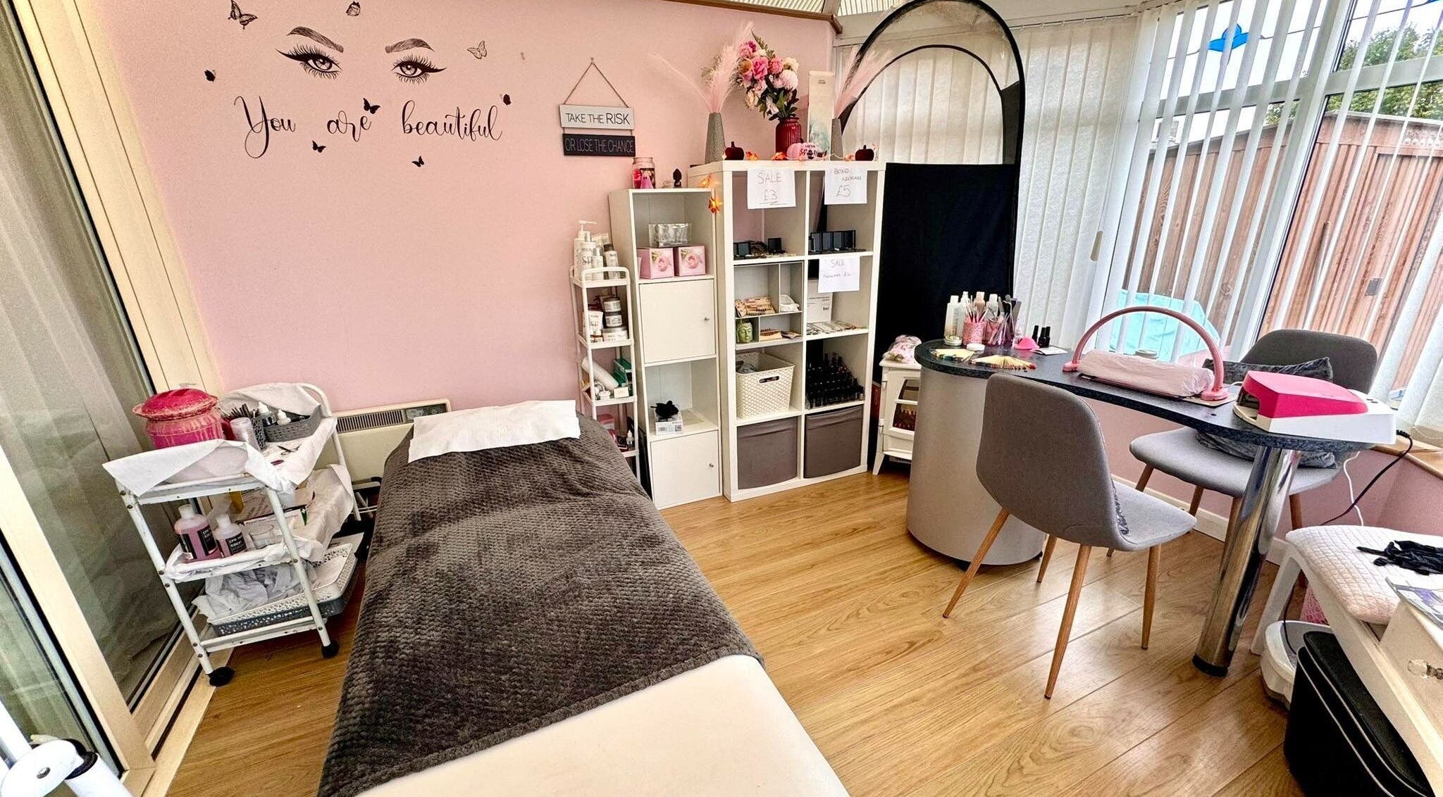 Cozy beauty room at Absolute Beauty & Aesthetics, North Hykeham, England, GB. Modern decor with pink accents.