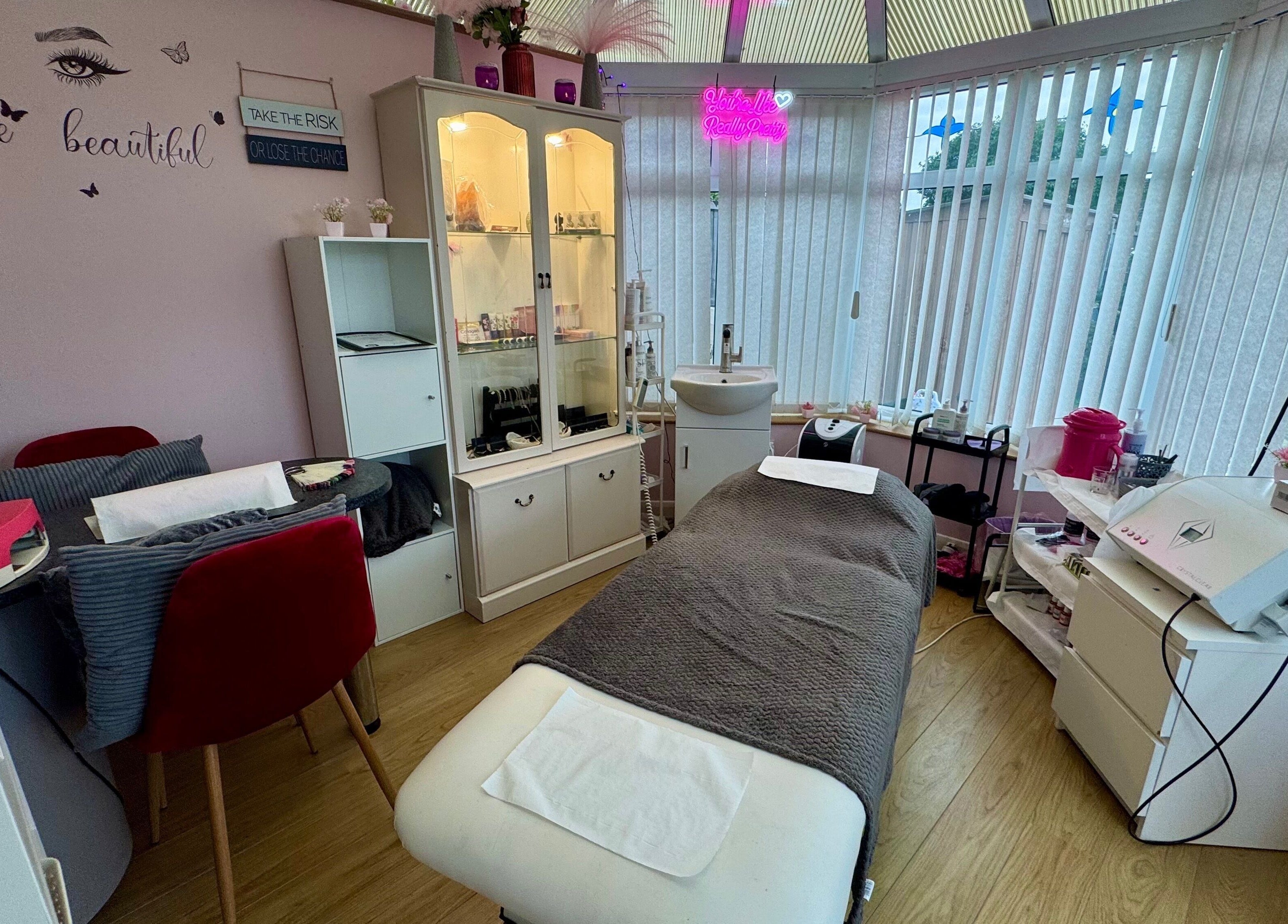 Relaxing treatment room at Absolute Beauty & Aesthetics, North Hykeham, England, GB with elegant decor.