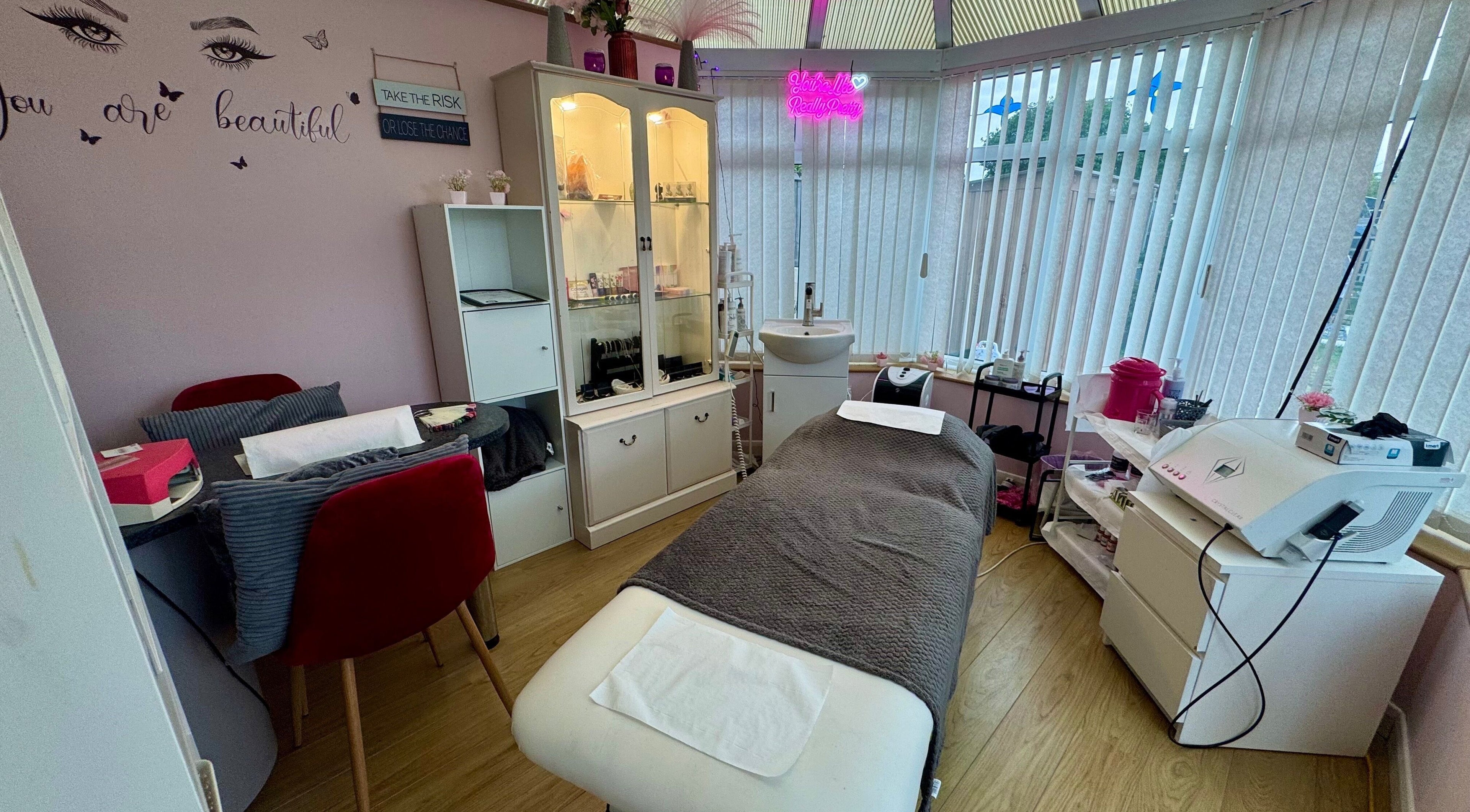 Relaxing treatment room at Absolute Beauty & Aesthetics, North Hykeham, England, GB with elegant decor.