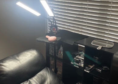 Beauty station at Enhanced Beauty, Florida, Florida, US with leather chair, shelves, and lighting.
