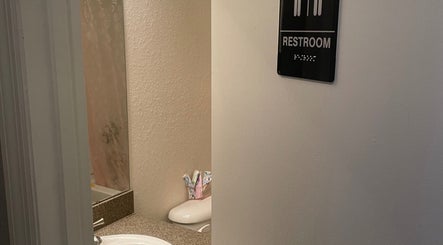 Clean restroom at Enhanced Beauty in Florida, Florida, US with modern amenities for guests.