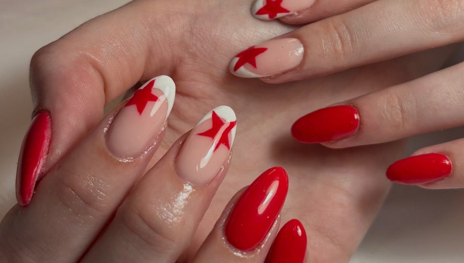 Red star nail art by Nailsby.S.B located in Worthing, England, GB. A chic and bold manicure design.