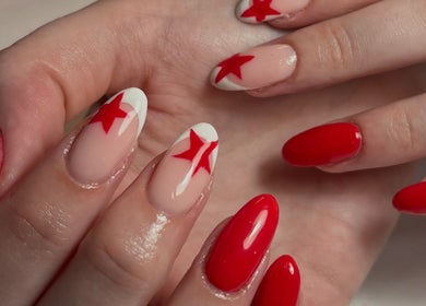 Red star nail art by Nailsby.S.B located in Worthing, England, GB. A chic and bold manicure design.