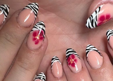 Stylish zebra and floral nail art by Nailsby.S.B in Worthing, England, GB enhances nail beauty.