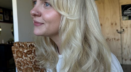 Close-up of a smiling woman with blonde hair at Shannon @ Daisy Bangs, Forster, New South Wales, AU.
