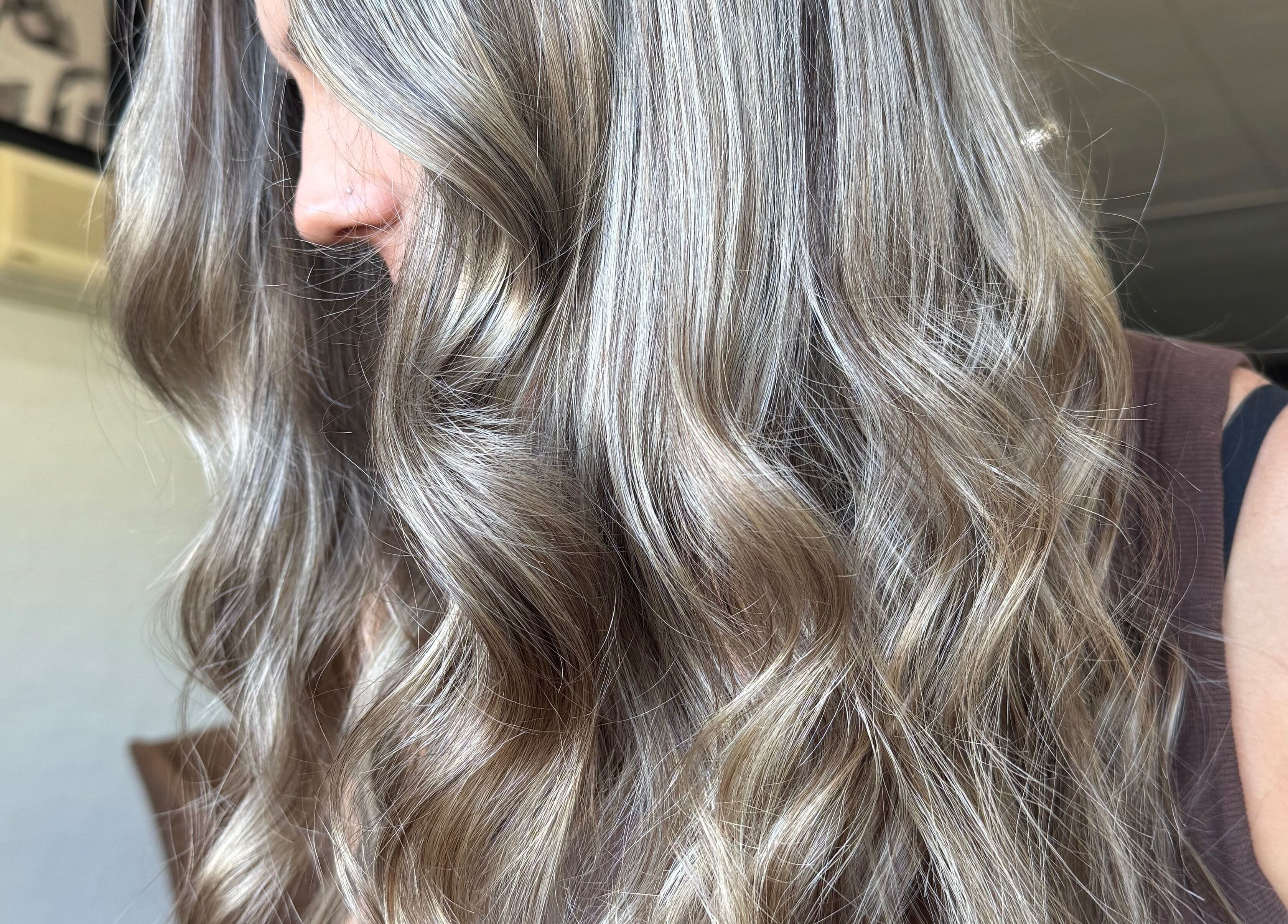 Elegant silvery curls styled at Shannon at Daisy Bangs, Forster, New South Wales, AU.