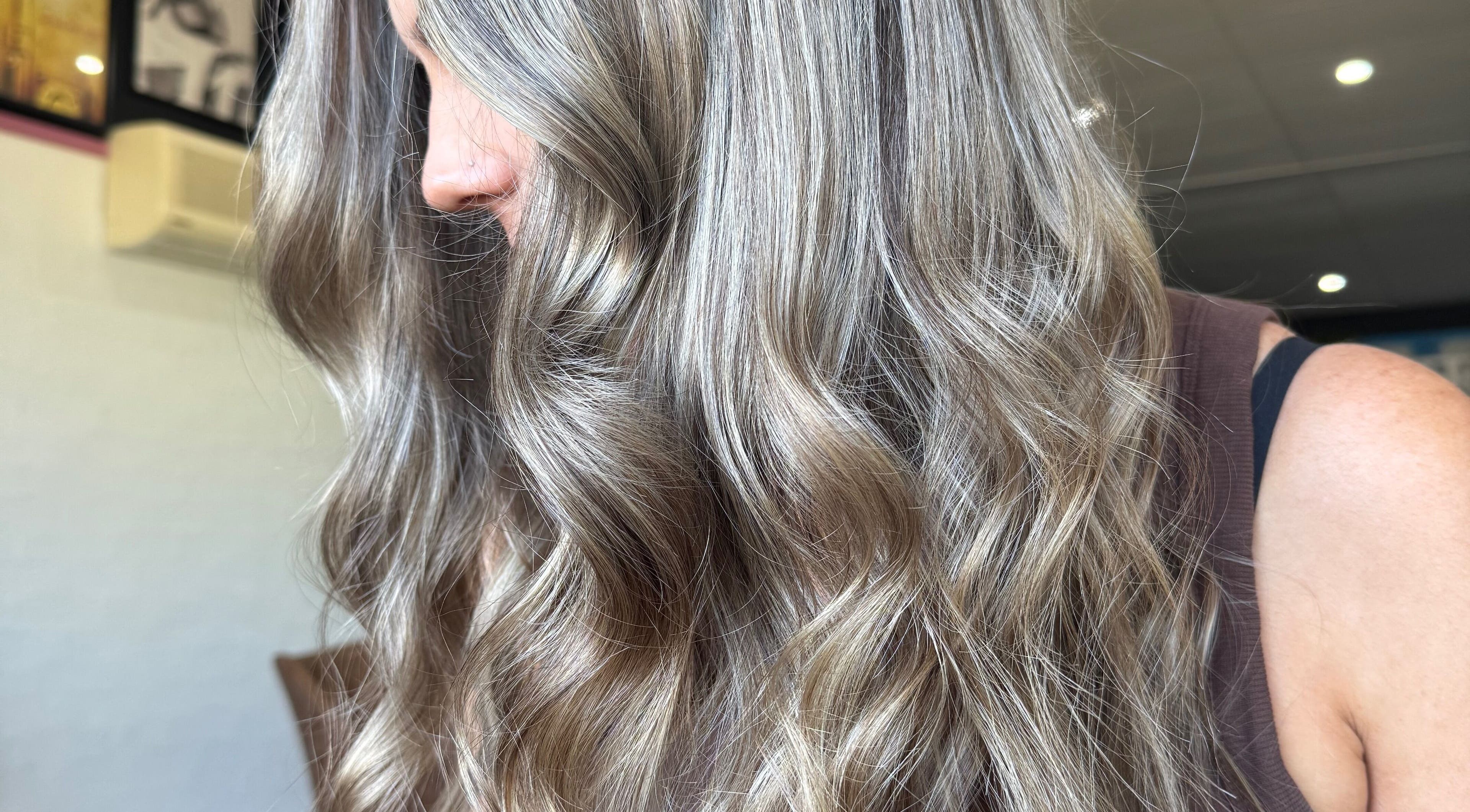 Elegant silvery curls styled at Shannon at Daisy Bangs, Forster, New South Wales, AU.