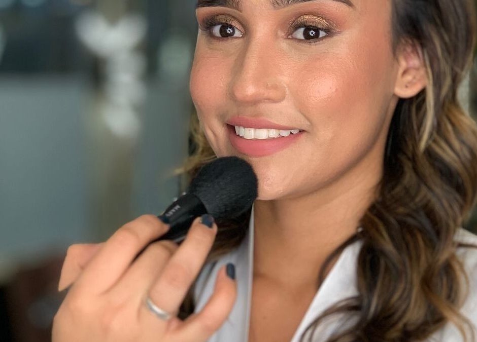 Woman receiving makeup application at Glam - Luxe by Lina E. in Victoria Park, Western Australia, AU.