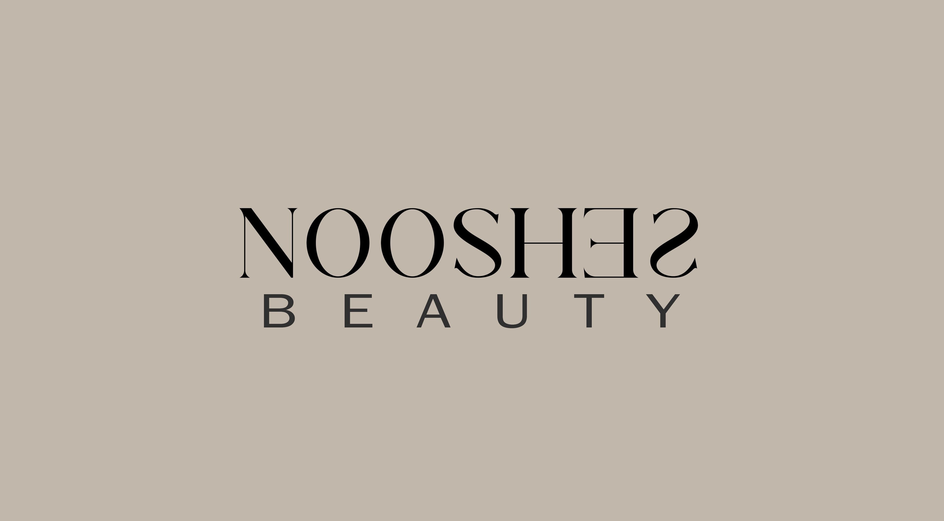 Logo of Nooshes Beauty Salon in Dubai, AE, featuring stylish typography on a neutral background.