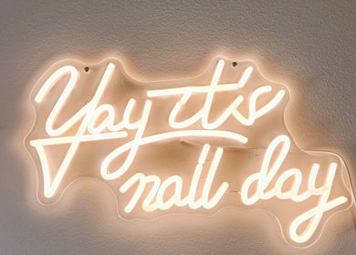 Neon sign saying 'Yay it's nail day' at Vanity Nail Studio, Richmond, British Columbia, CA.
