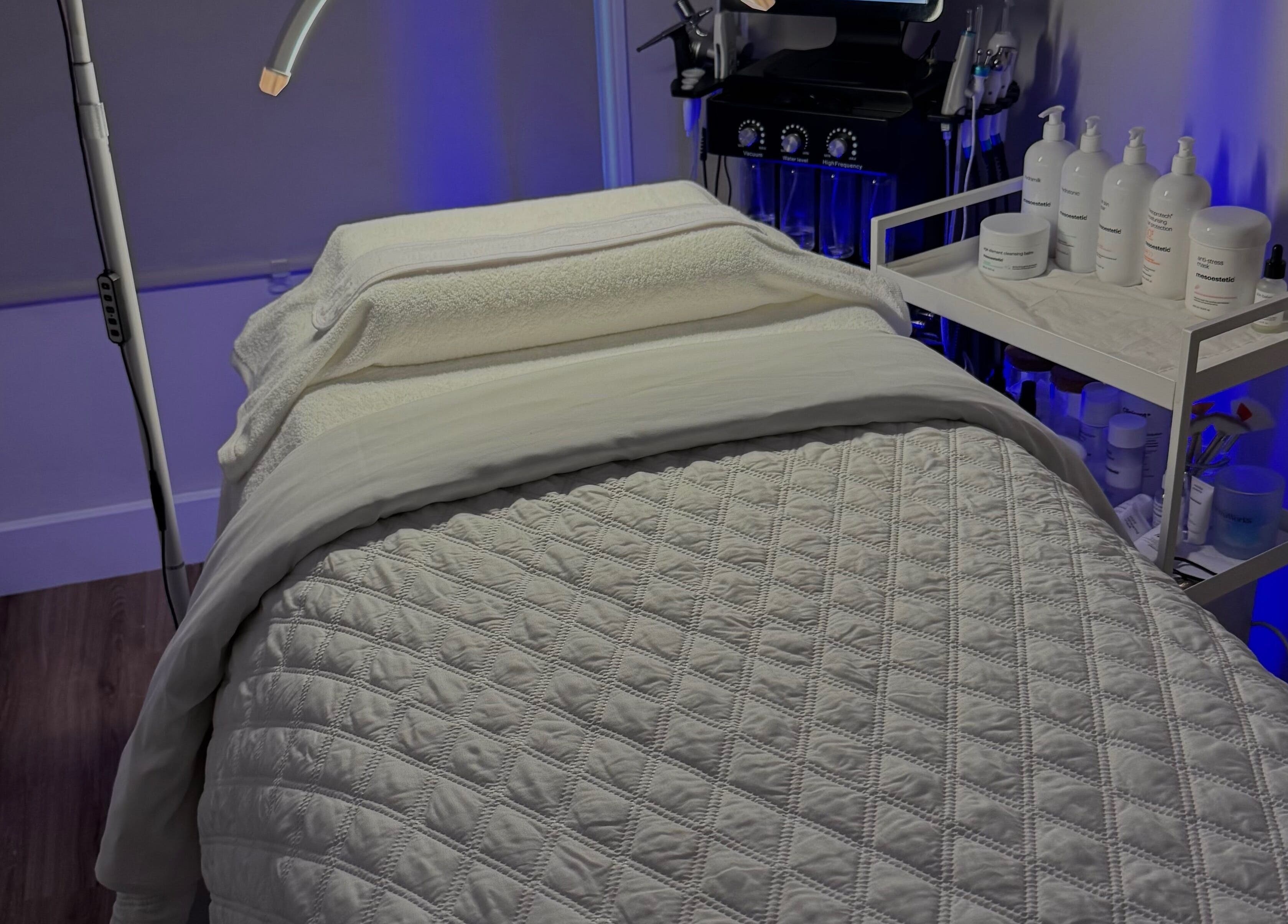 Cozy treatment room at Fierce Wellness Ltd, Ingatestone, England, GB with a neatly arranged massage bed.