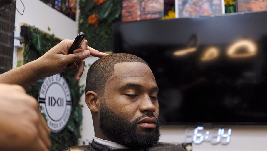 Expert barber crafting precise haircut at House Of Brix, Coral Springs, Florida, US.