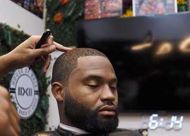 Expert barber crafting precise haircut at House Of Brix, Coral Springs, Florida, US.