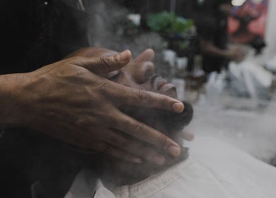 Man receiving facial steam treatment at House Of Brix, Coral Springs, Florida, US.