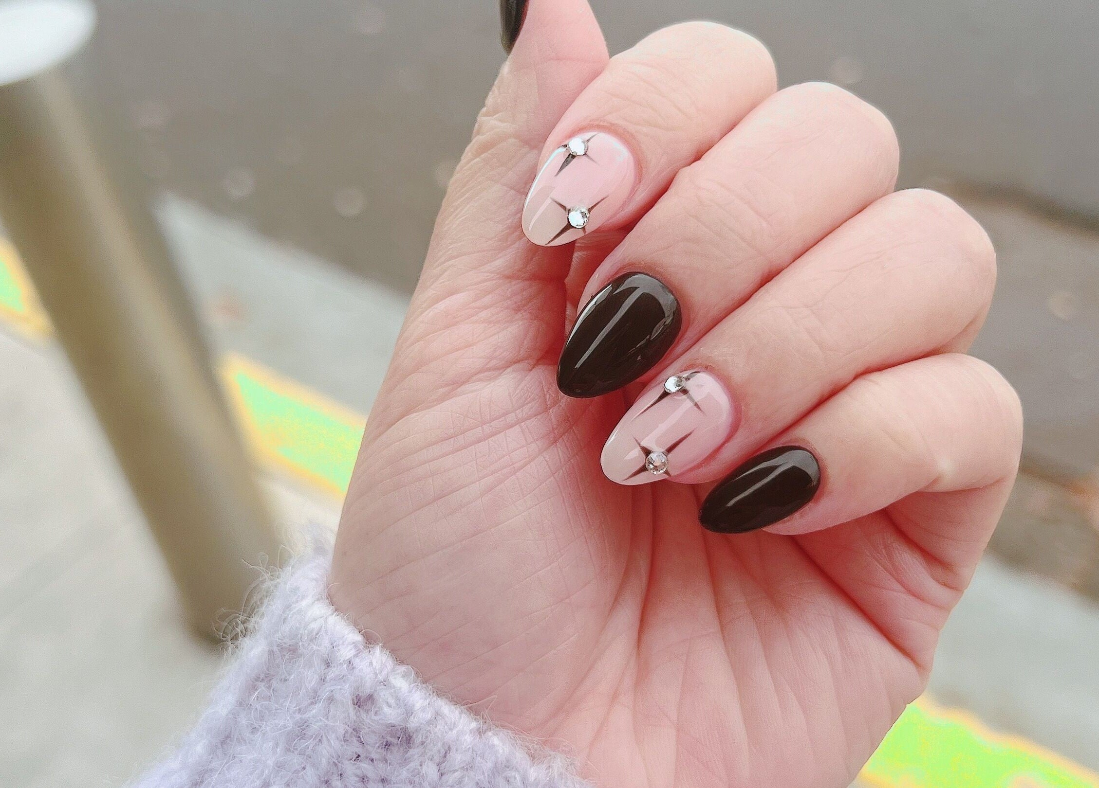 Stylish black and pink nail design with gems at Natural Nails and Beauty Gisborne, Gisborne, Victoria, AU.