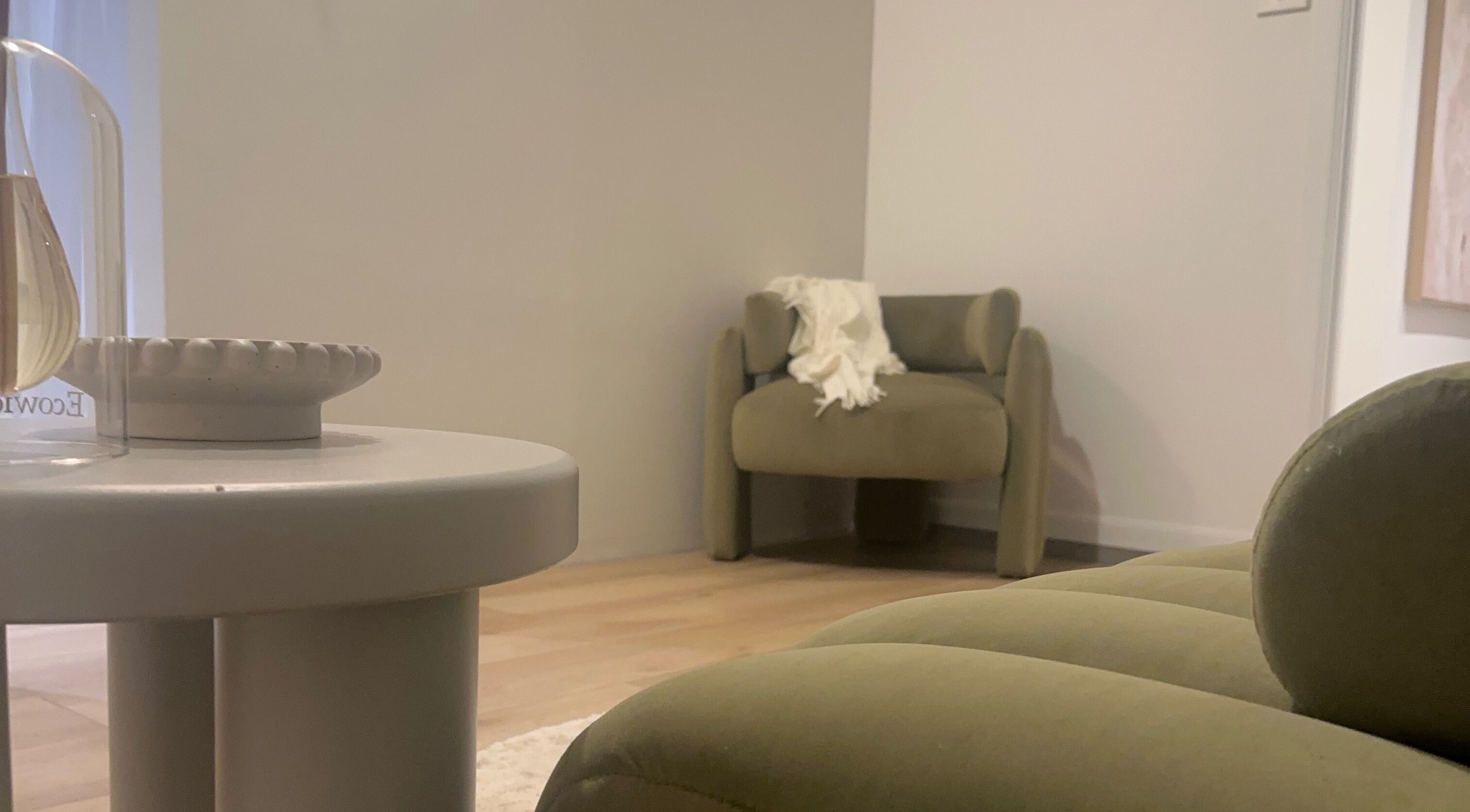 Modern lounge area at Eve Soleil, Dapto, New South Wales, AU featuring elegant seating and minimal decor.