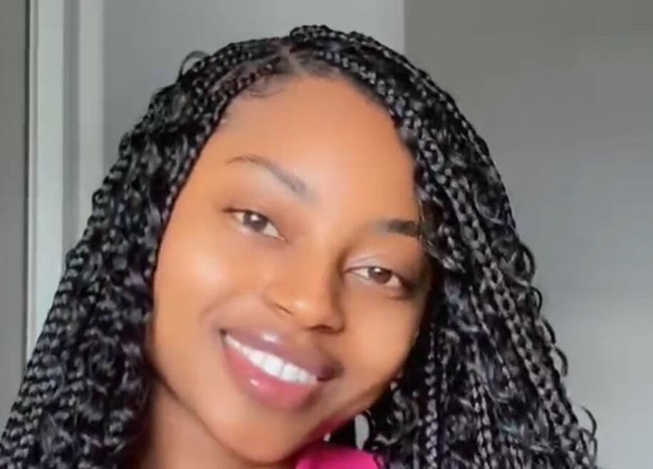 Smiling person with braided hairstyle at Beauty Beyond Expectation, Windhoek, Khomas Region, NA.