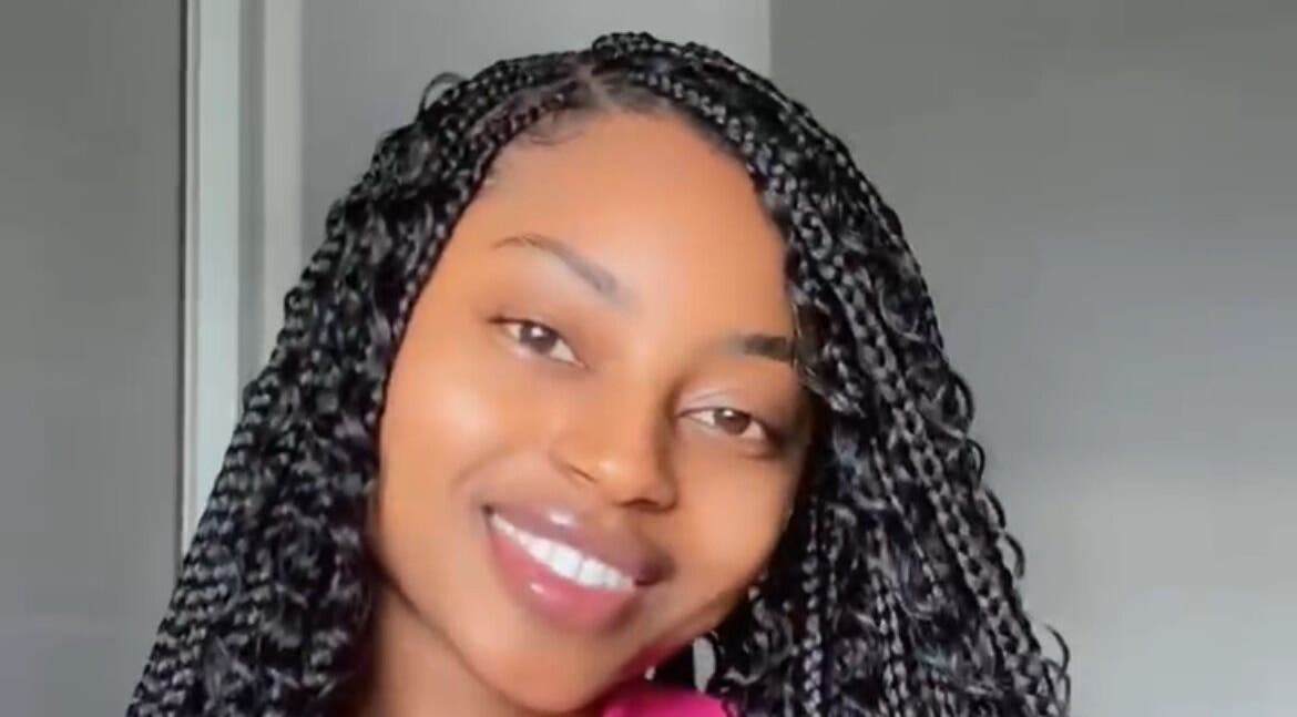 Smiling person with braided hairstyle at Beauty Beyond Expectation, Windhoek, Khomas Region, NA.