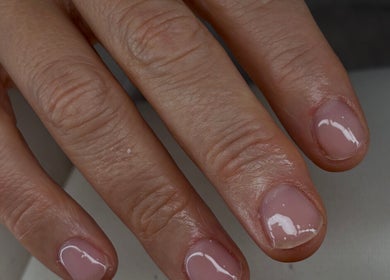 Glossy manicured nails at Nails by Evie in Plymouth, England, GB showcasing expert nail care.