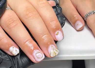 Elegant nail art with gold accents at Nails by Eils, Kirkcaldy, Scotland, GB.