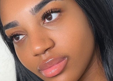Close-up of a woman's radiant skin and lush lashes at Bynndll, Ajax, Ontario, CA.