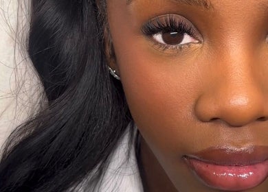 Close-up of elegant lash extensions at Bynndll, Ajax, Ontario, CA on a serene and smiling face.