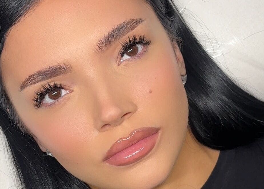 Close-up of flawless skin and long lashes at Bynndll, Ajax, Ontario, CA showcasing beauty services.