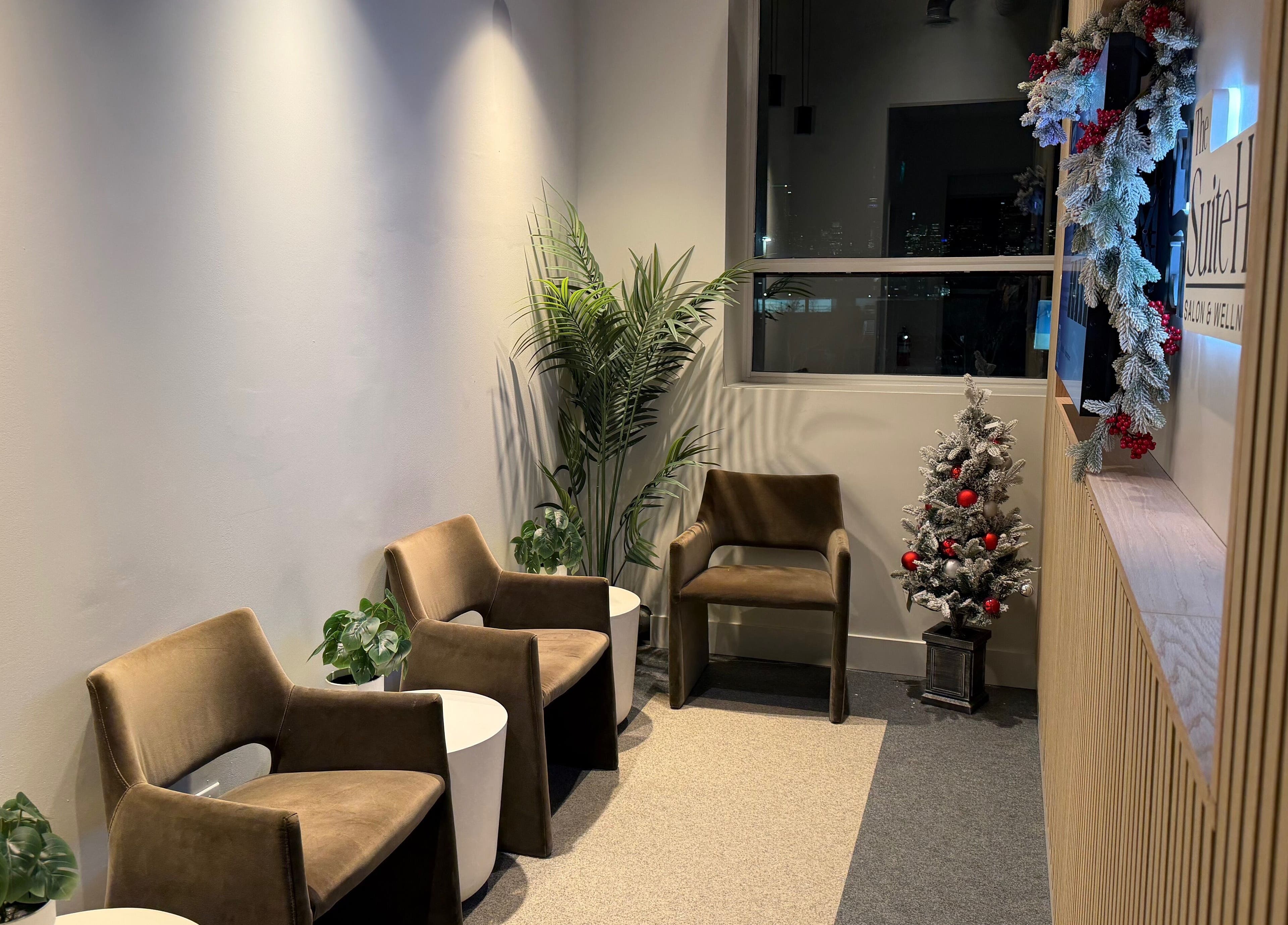 Cozy seating area at Bynndll, Ajax, Ontario, CA with modern chairs and festive decor.