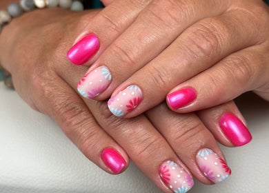 Bright floral nail art at Nail Perfection, Armstrong, British Columbia, CA, showcases vibrant style and precision.