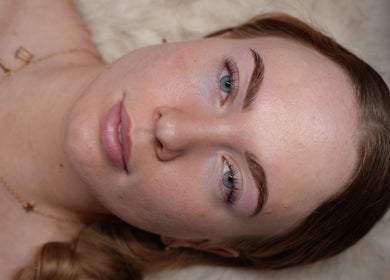 Close-up of a woman's face showcasing natural skin and brows at Ethereal Beauty, Ascot, Queensland, AU.