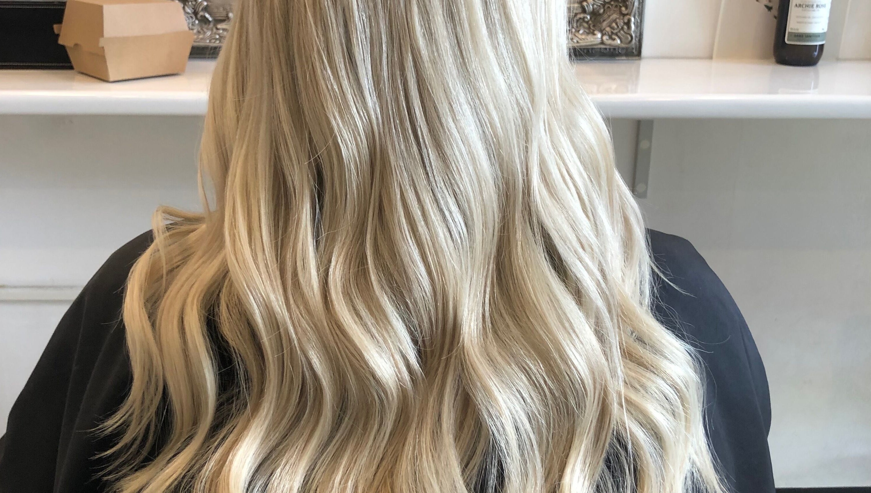 Blonde wavy hairstyle showcased at Hair By April and Co., Greenpoint, New South Wales, AU.