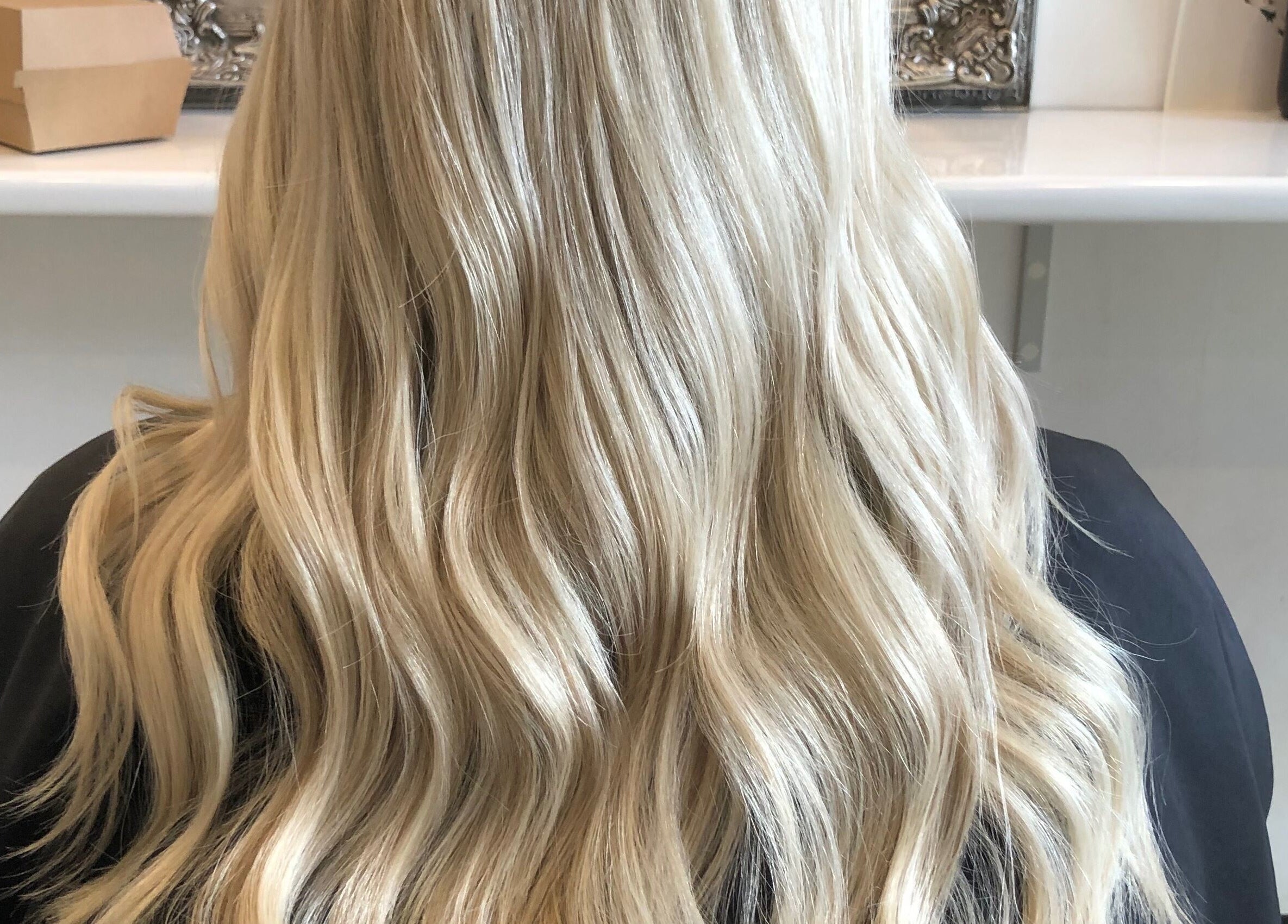 Blonde wavy hairstyle showcased at Hair By April and Co., Greenpoint, New South Wales, AU.