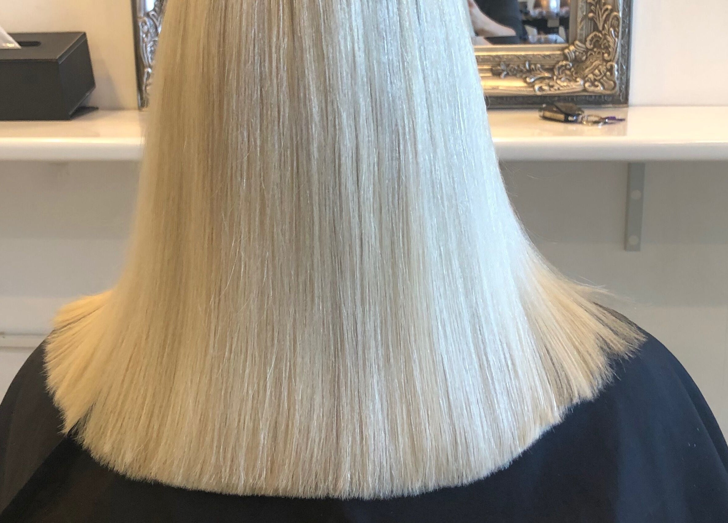 Sleek blonde haircut at Hair By April and Co., Greenpoint, New South Wales, AU.