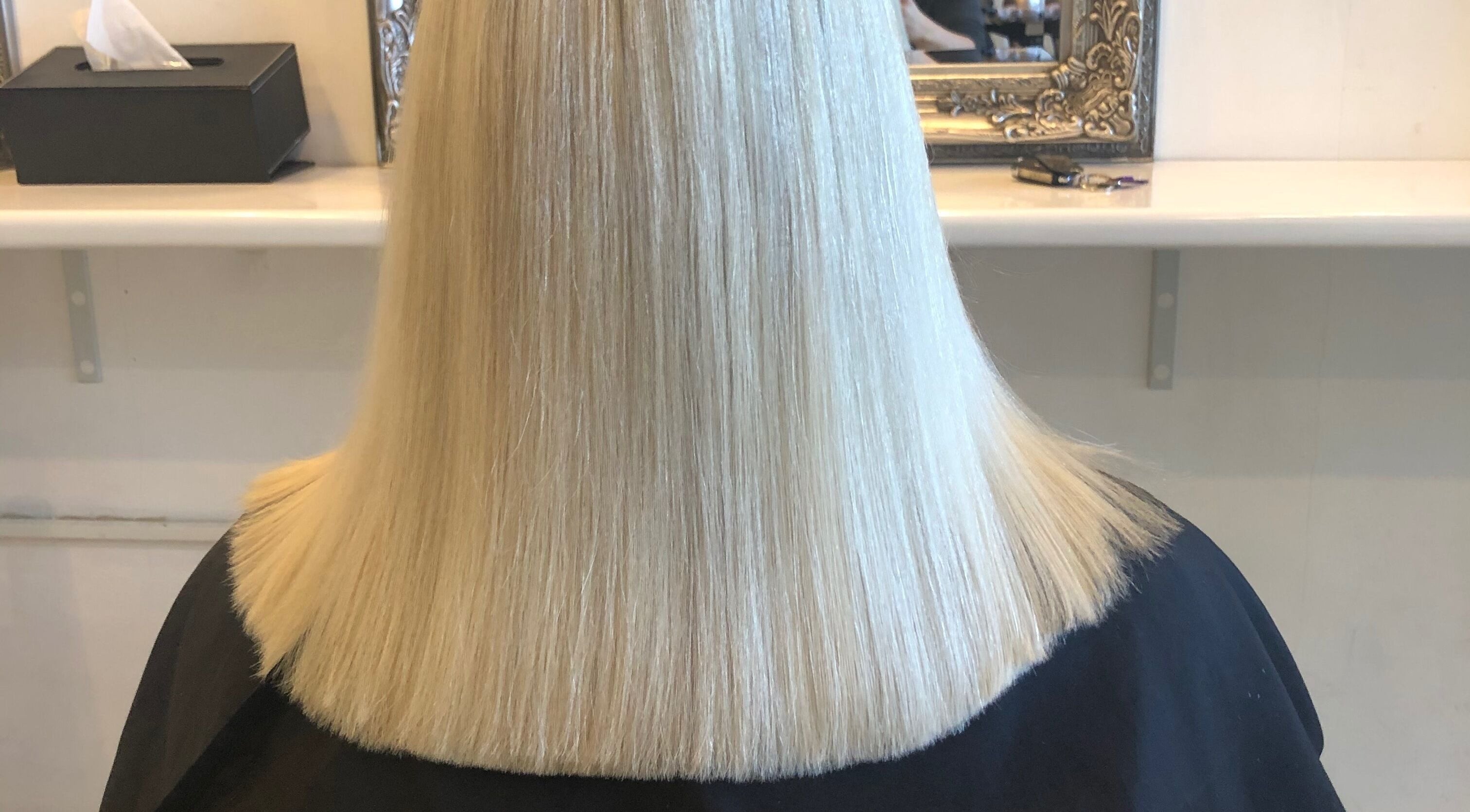 Sleek blonde haircut at Hair By April and Co., Greenpoint, New South Wales, AU.