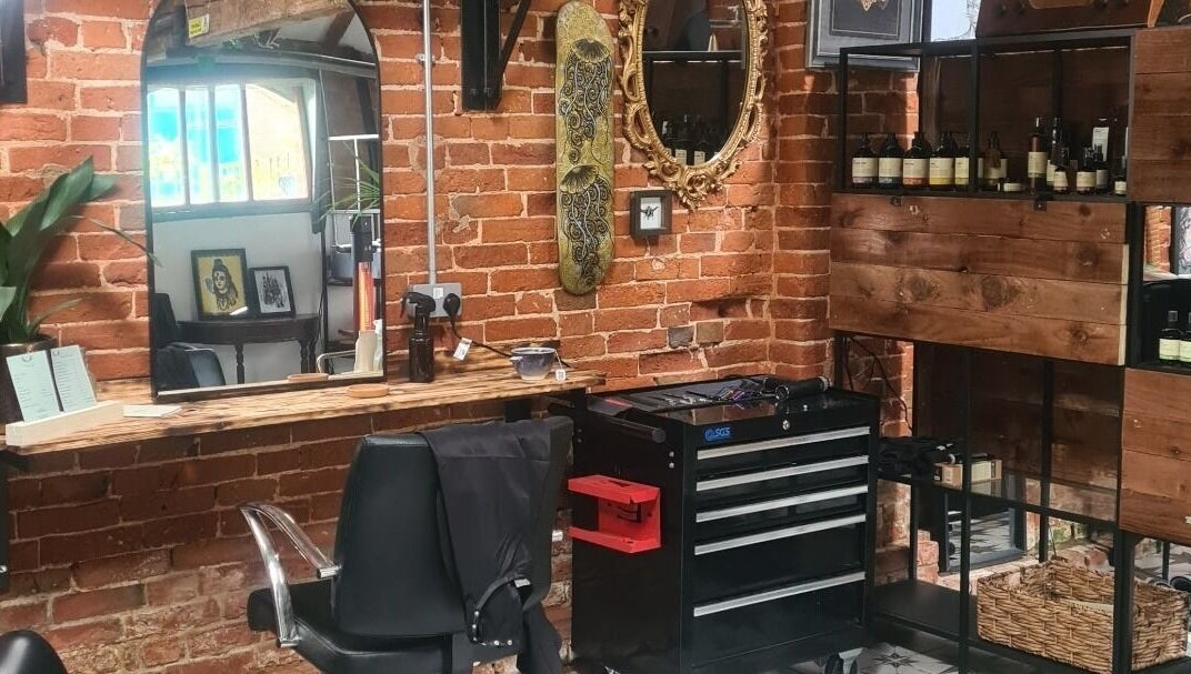 Interior of Louise Frances salon in Derby, England, GB with rustic brick walls and stylish decor.