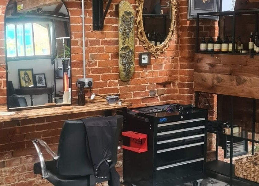 Interior of Louise Frances salon in Derby, England, GB with rustic brick walls and stylish decor.