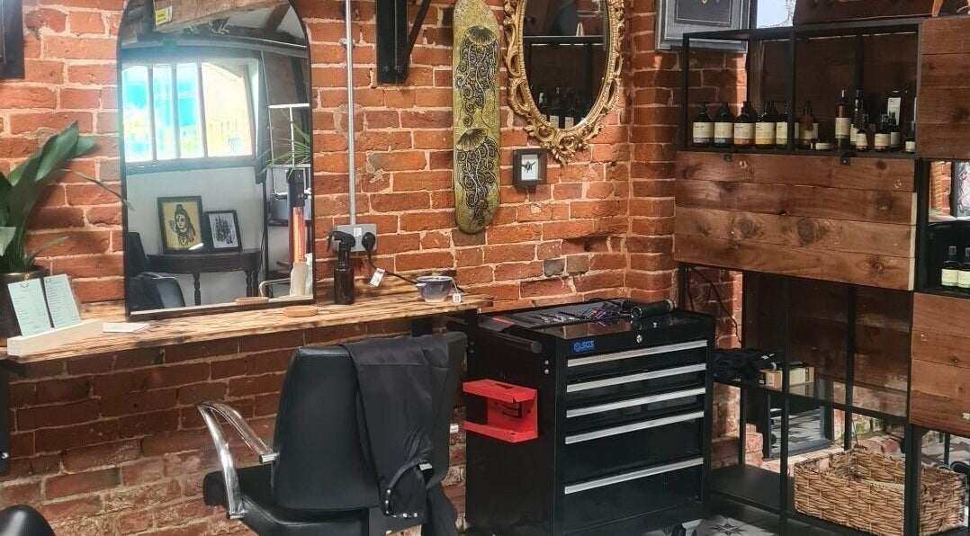 Interior of Louise Frances salon in Derby, England, GB with rustic brick walls and stylish decor.