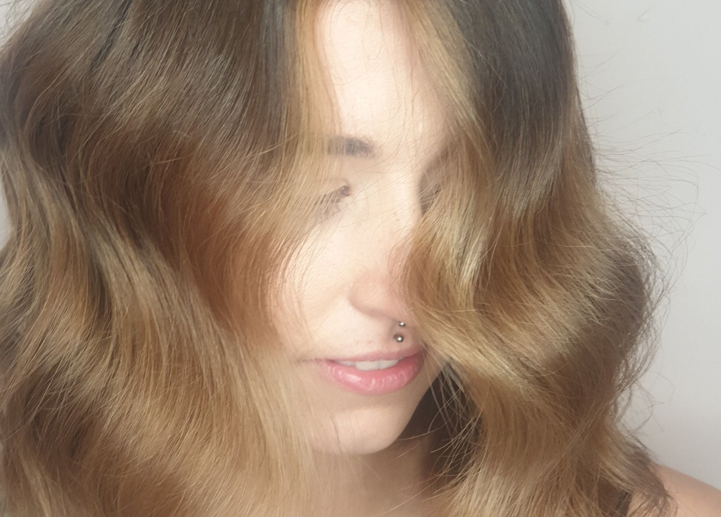 Stylish wavy hairstyle at Louise Frances, Derby, England, GB showcasing modern beauty trends.
