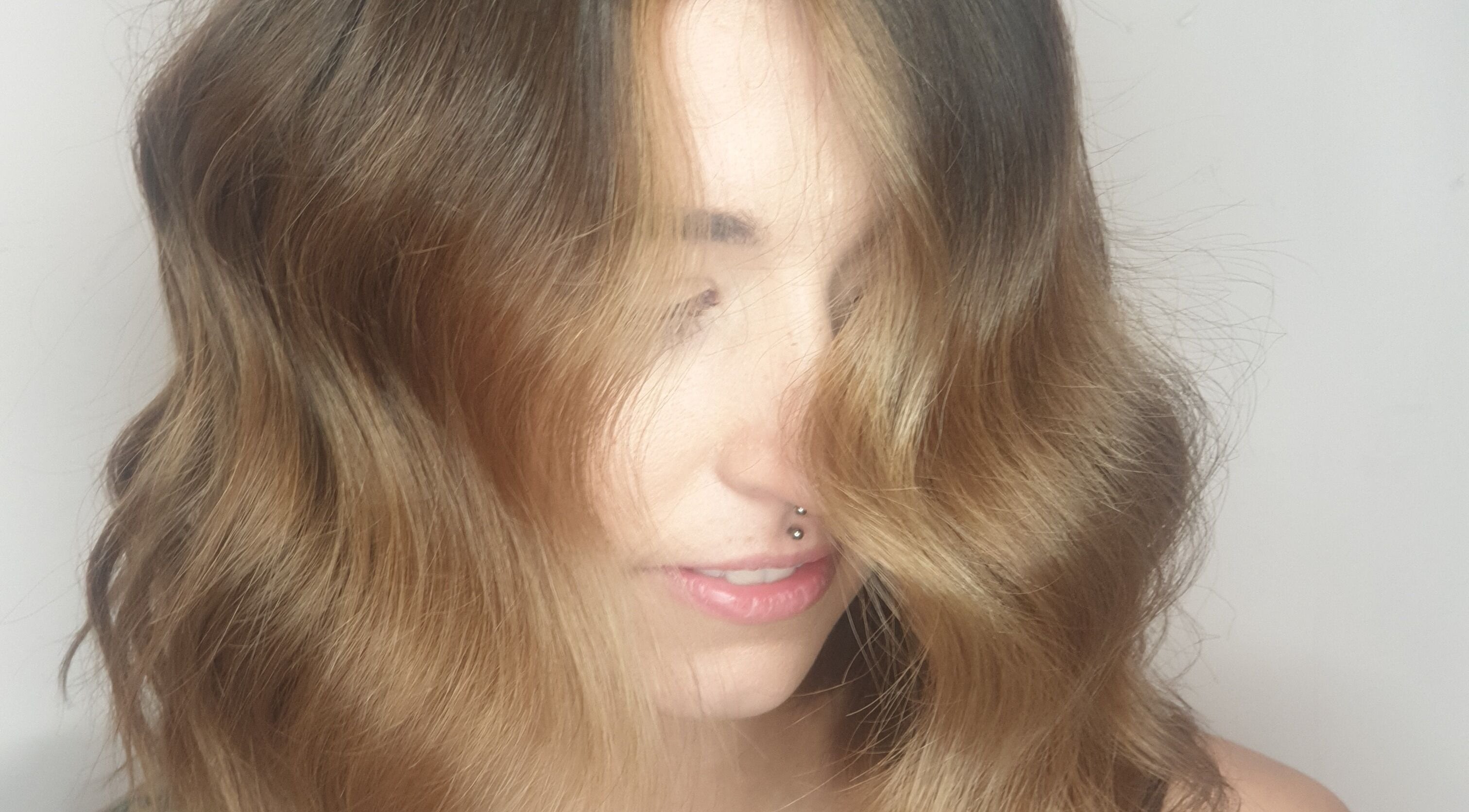 Stylish wavy hairstyle at Louise Frances, Derby, England, GB showcasing modern beauty trends.