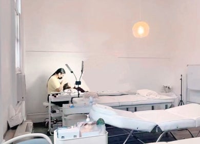 Lashqueencoco CBD's serene lash treatment room in Melbourne, Victoria, AU with a specialist and client.