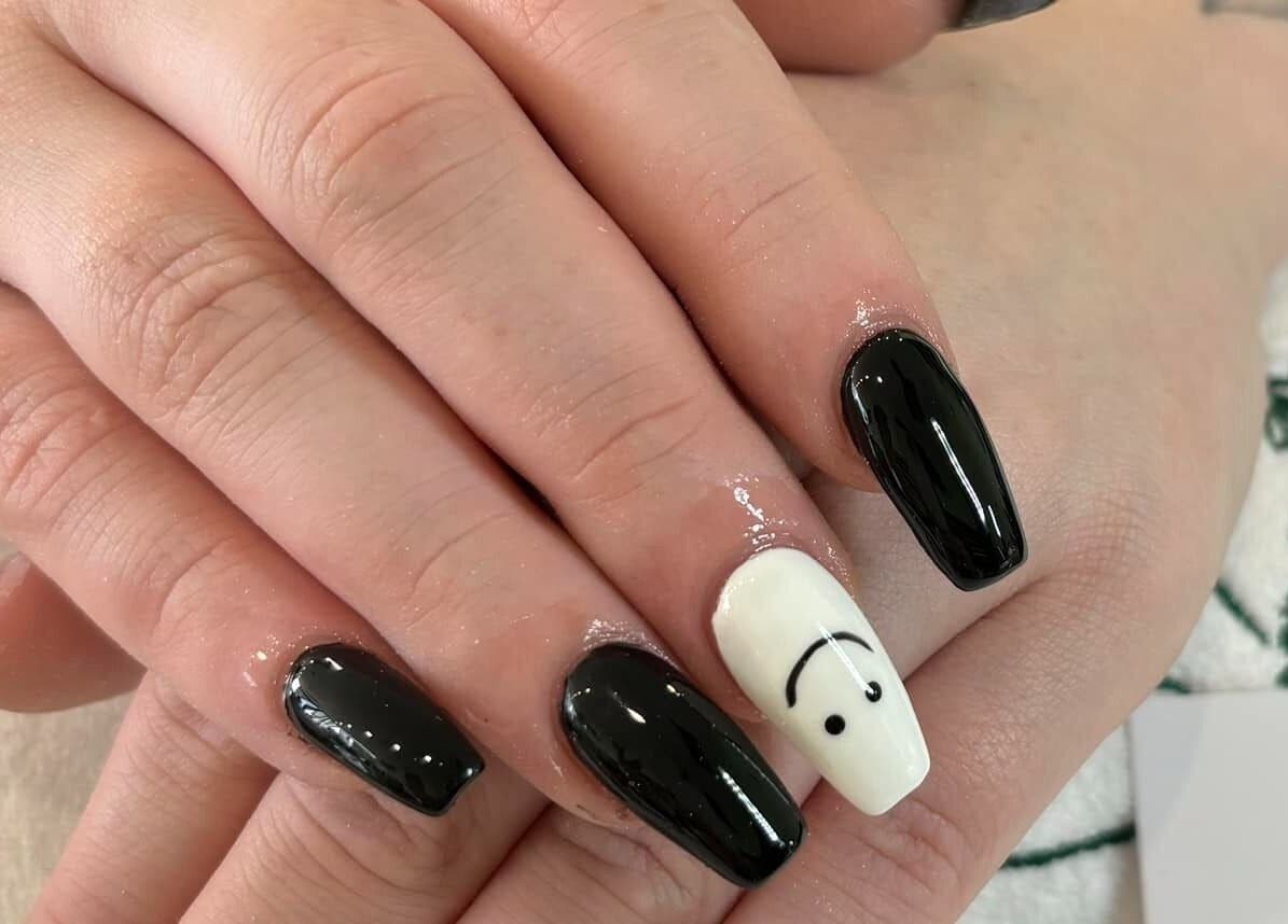 Stylish black and white nails with art detail at D.T Nails Spa Yarrabilba, in Yarrabilba, Queensland, AU.