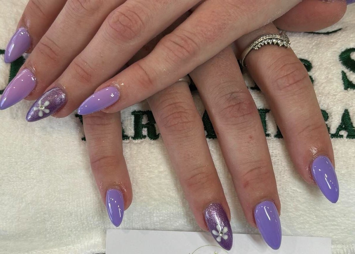 Lavender nail art with floral accent at D.T Nails Spa Yarrabilba, Yarrabilba, Queensland, AU.