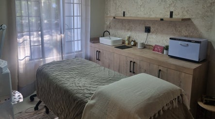 Cozy treatment room at Sweet Escape Beauty, Sandton, Gauteng, ZA with soft lighting and modern decor.