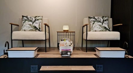 Cozy spa chairs at Sweet Escape Beauty, Sandton, Gauteng, ZA with plush cushions and a serene setting.