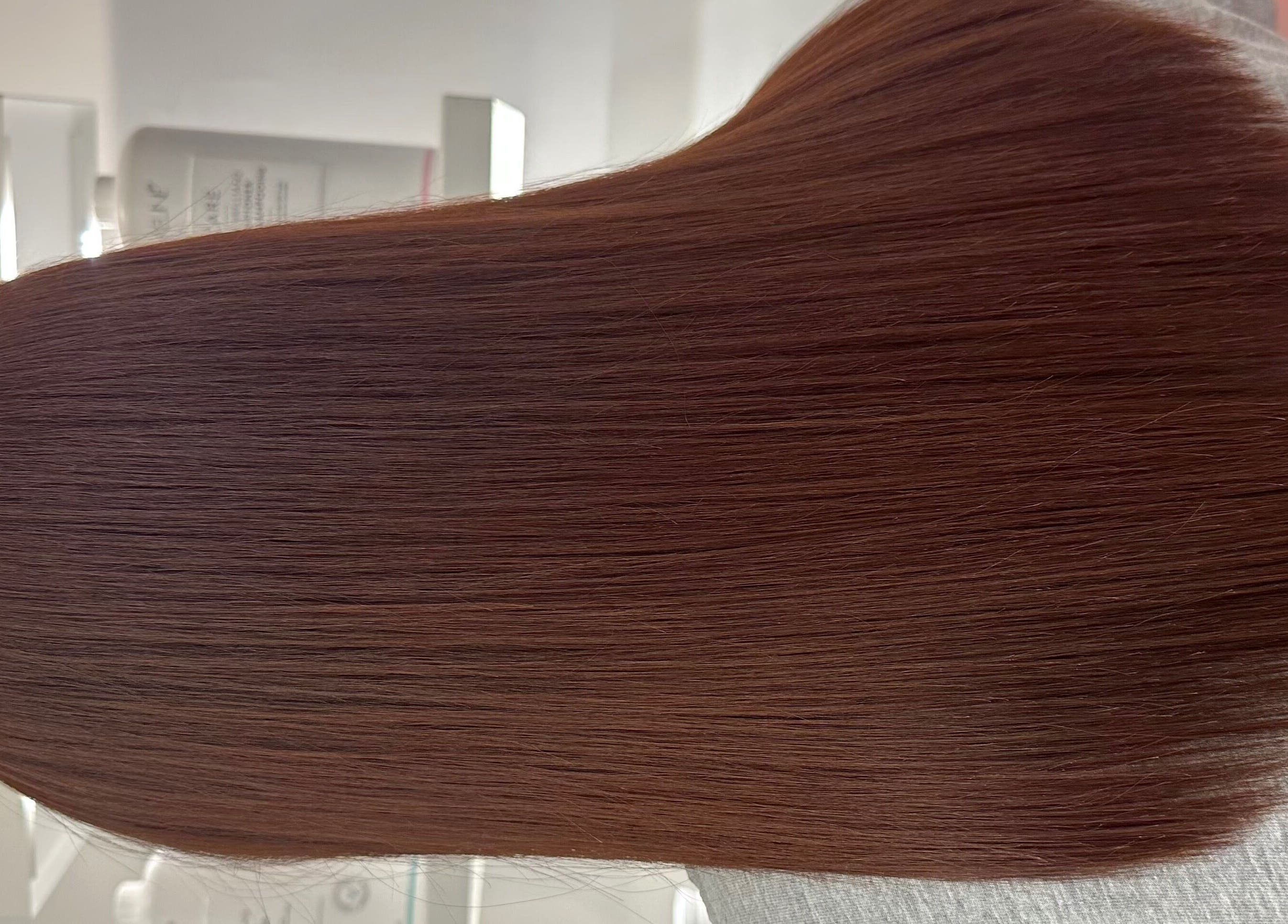 Glossy, smooth hair styled at Hair by Clement, Sydney, New South Wales, AU showcasing radiant texture.