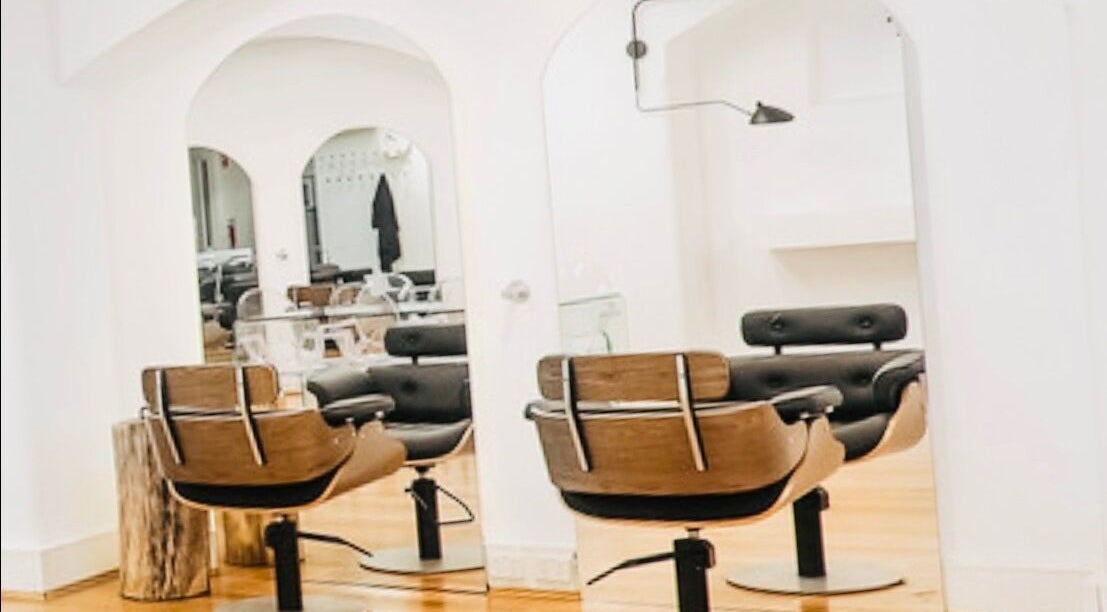 Elegant salon interior at Hair by Clement, Sydney, New South Wales, AU, showcasing modern design and comfort.