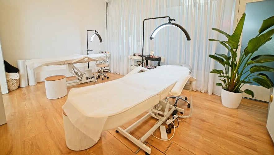 Elegant treatment room at The Lash Squad, Melbourne, Victoria, AU with modern chairs and serene decor.