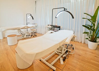 Elegant treatment room at The Lash Squad, Melbourne, Victoria, AU with modern chairs and serene decor.