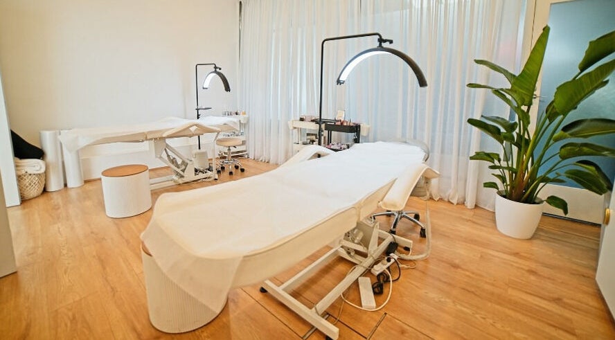 Elegant treatment room at The Lash Squad, Melbourne, Victoria, AU with modern chairs and serene decor.